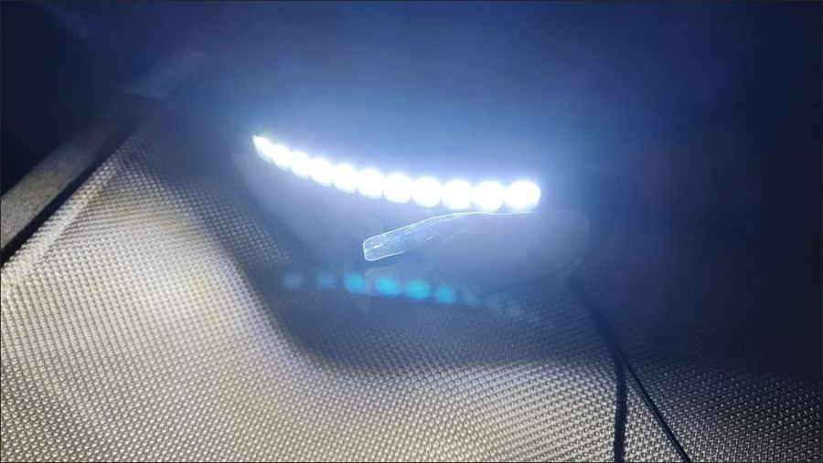 Unedited phone photo of Iron Beam goggles: lights on, in the dark
